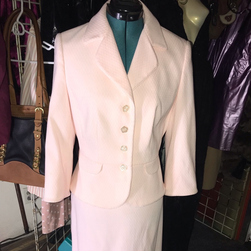 Pink Tahari suit.